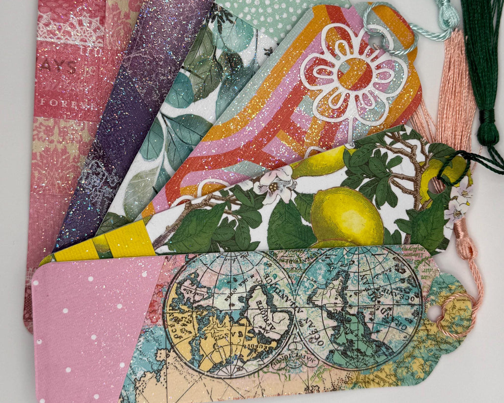 Colorful fabric bookmarks with various patterns on a white background