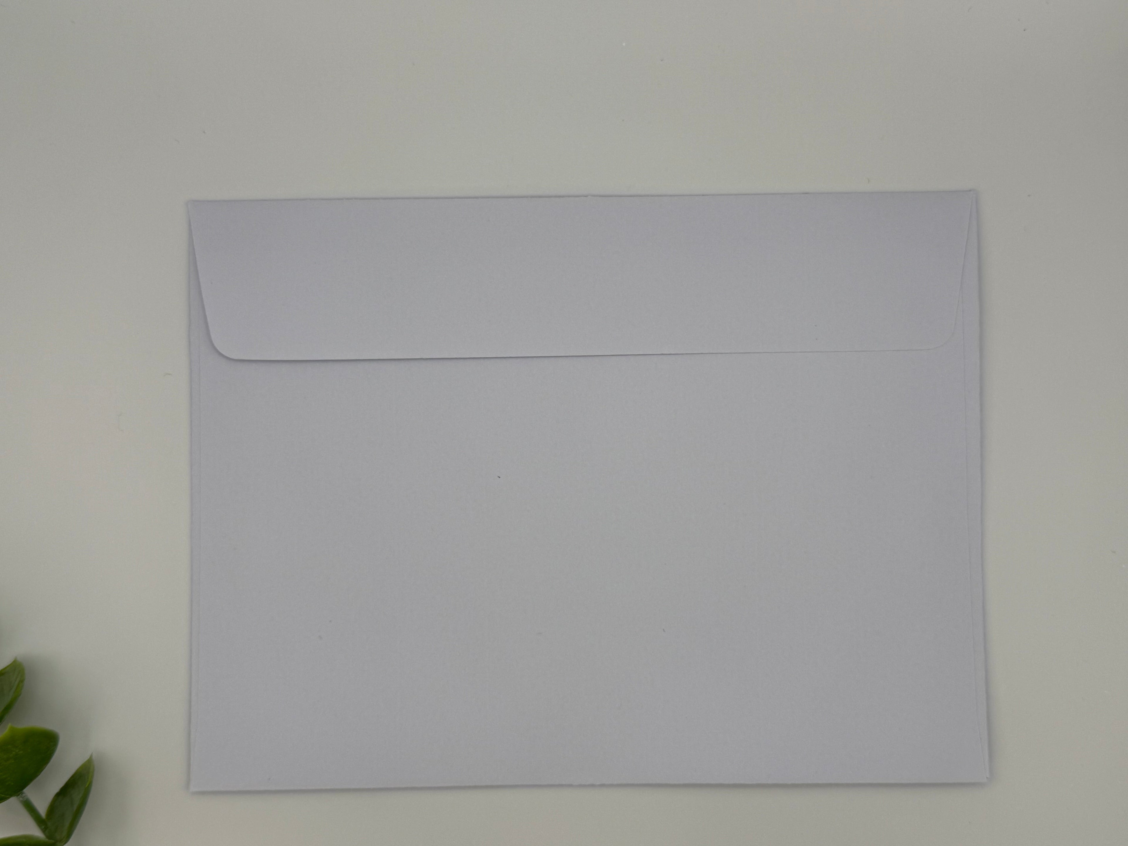 Plain white envelope on a light gray background